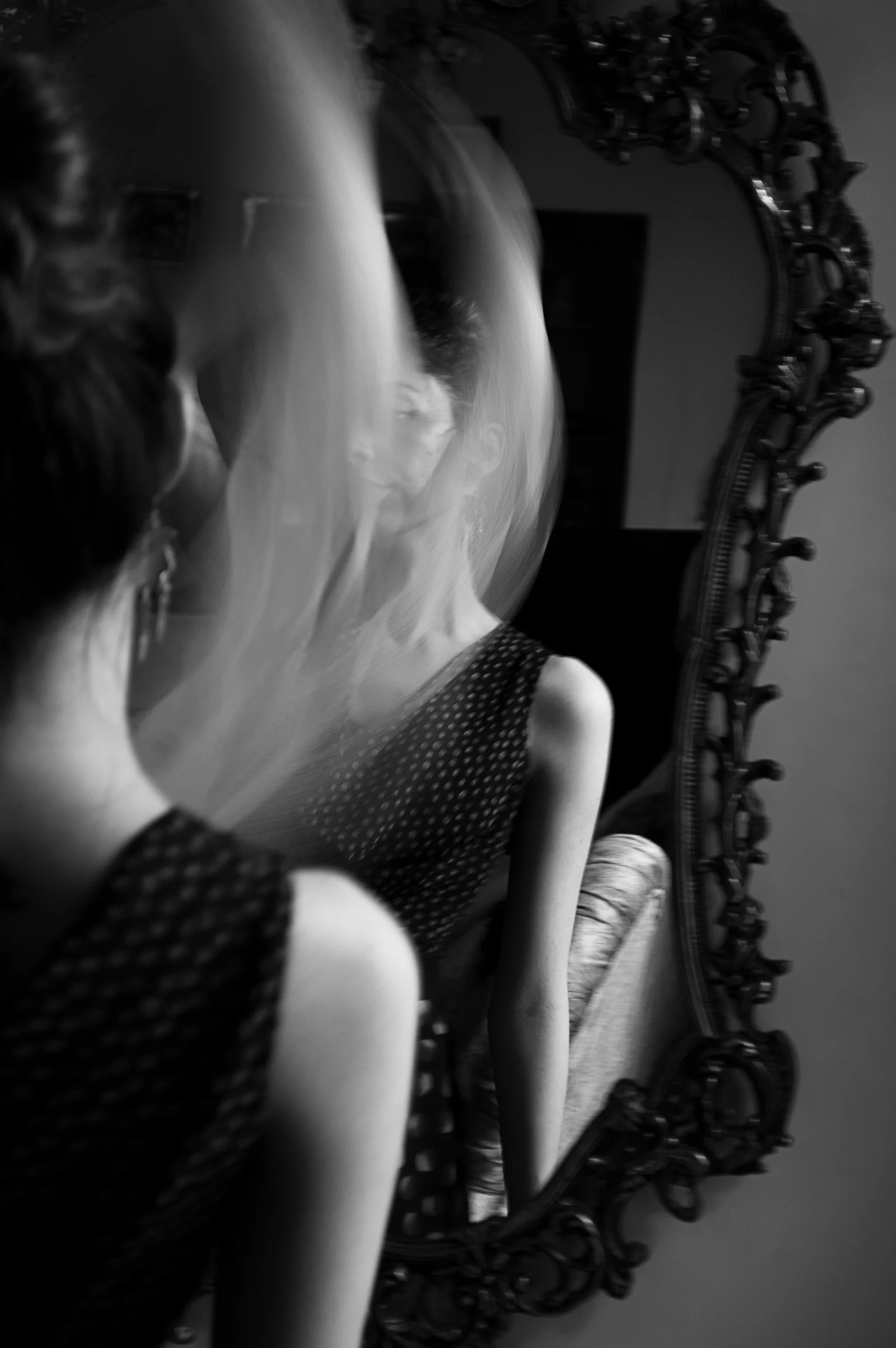 a woman looking at herself in the mirror