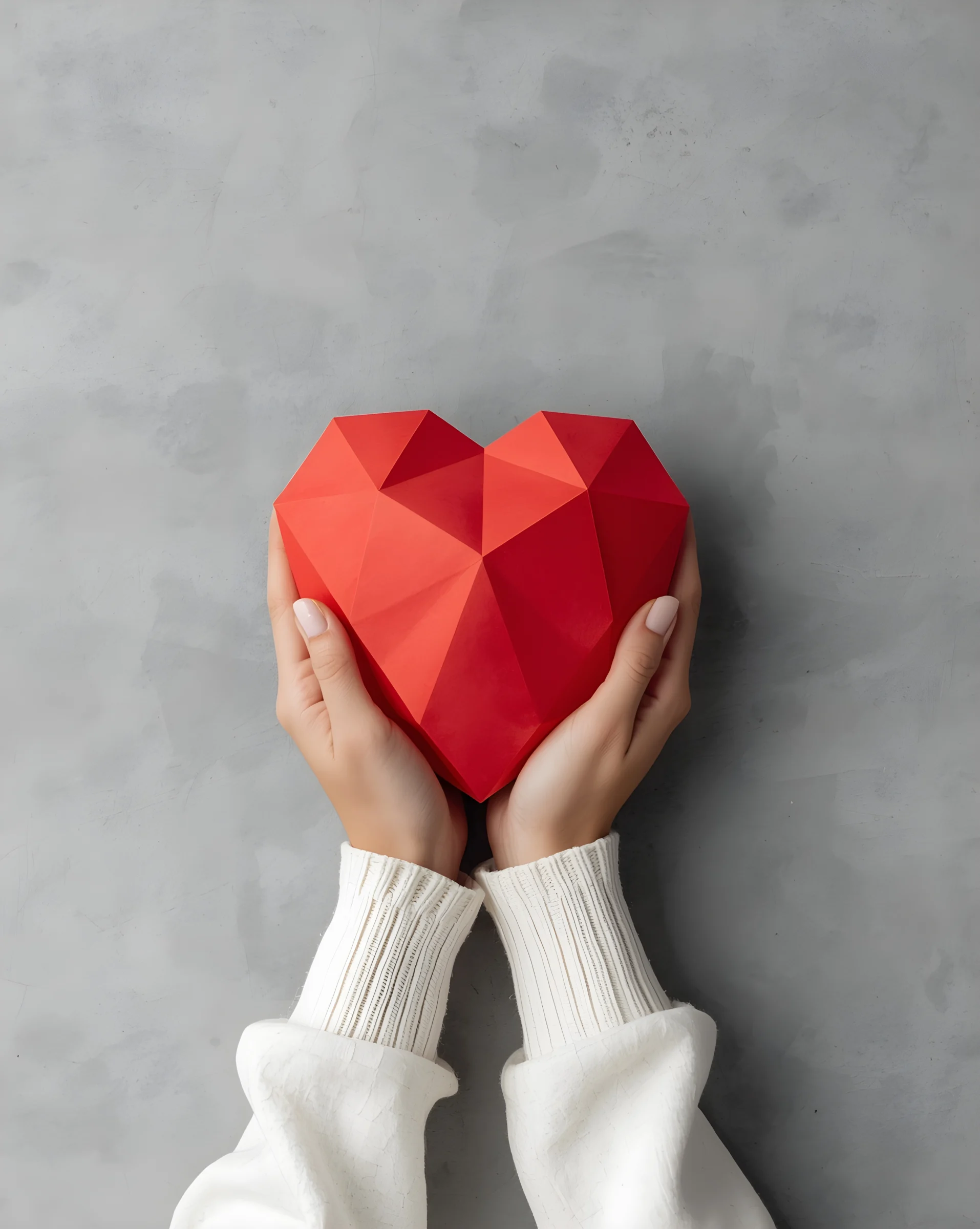 Heart love care symbol held in human hands